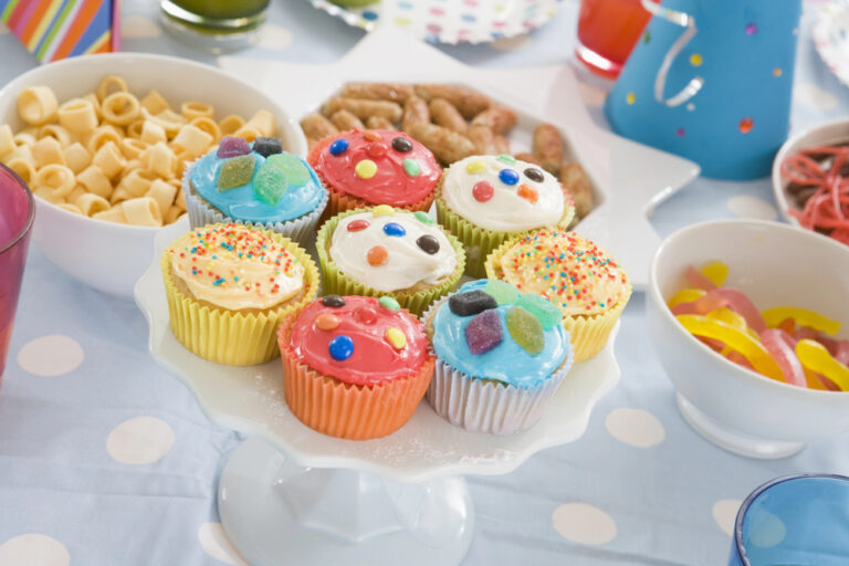 Birthday party table setting with food