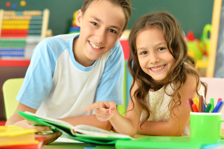 Brother and sister doing homework together