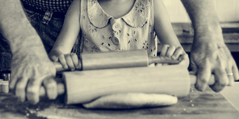 Girl cooking with father