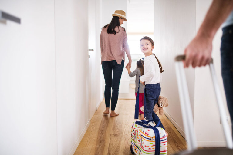 Young family with two children going on a holiday.